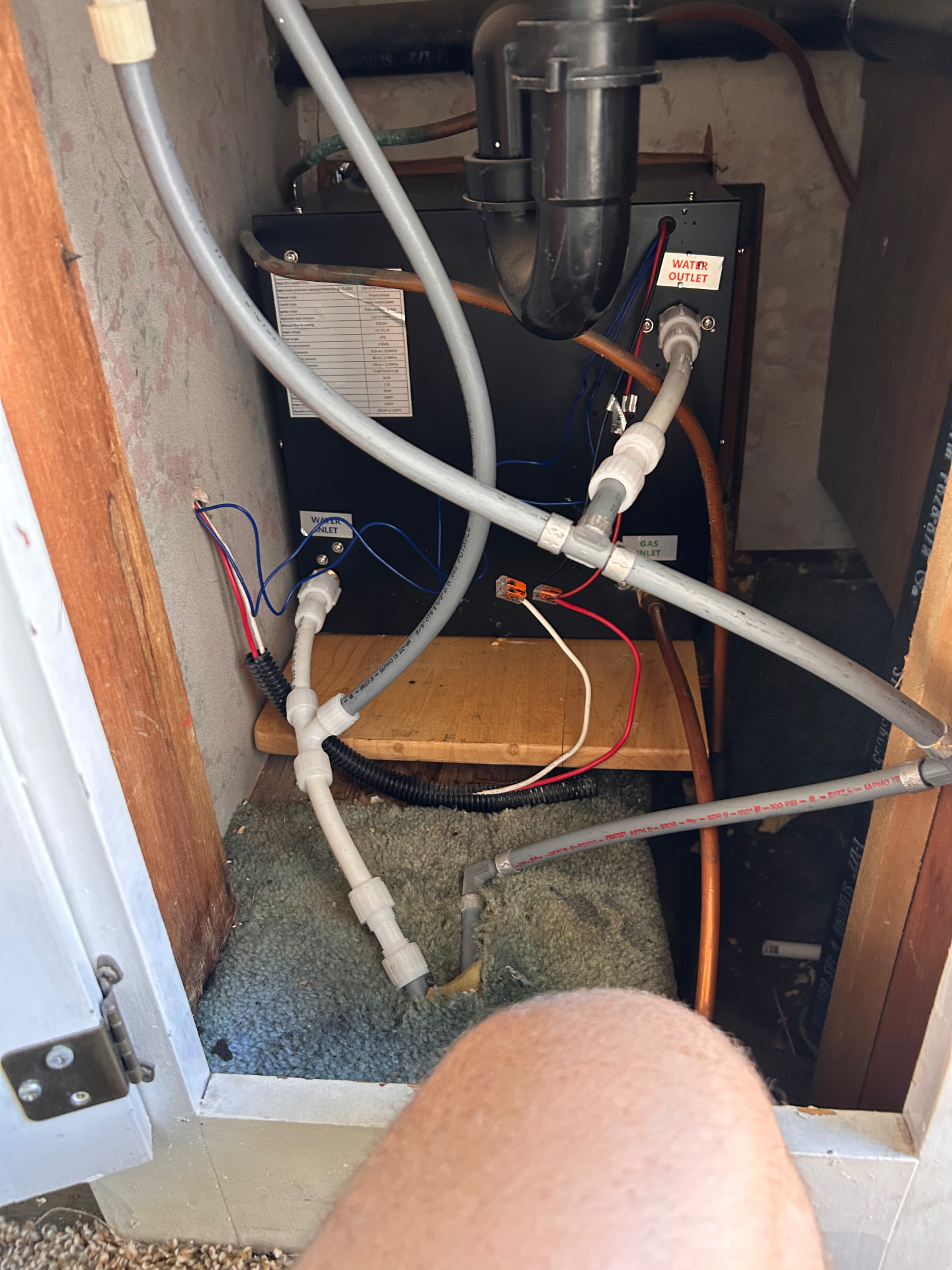 RV water heater and plumbing connections during service